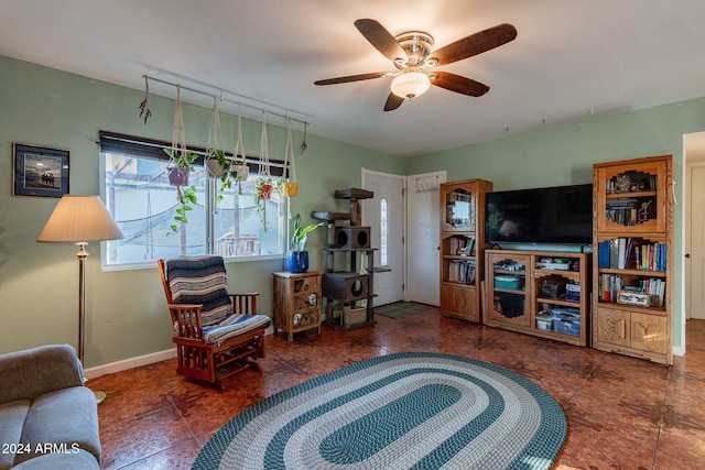 sitting room featuring ceiling fan