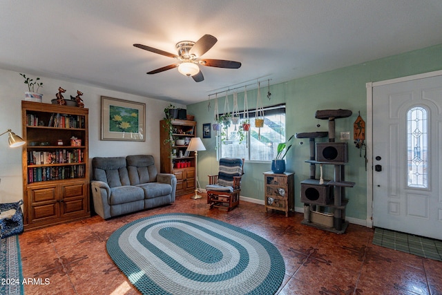 living room with tile patterned flooring and ceiling fan