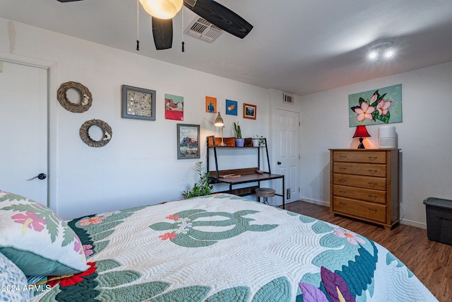 bedroom with dark wood-type flooring and ceiling fan