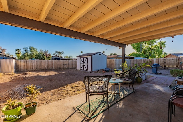 view of patio featuring a shed