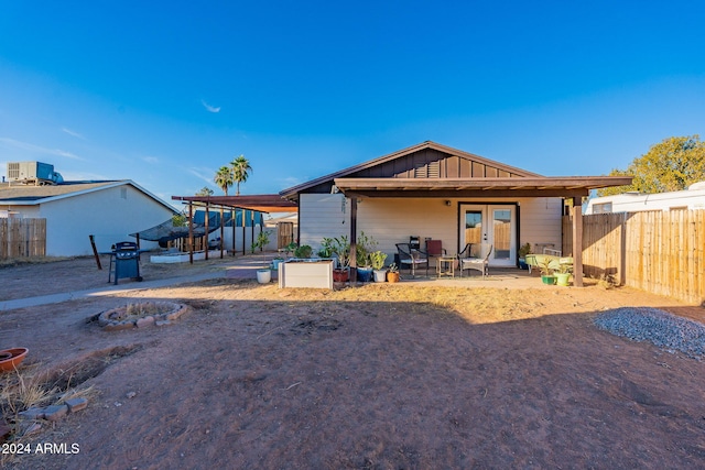 rear view of property with a patio area and french doors