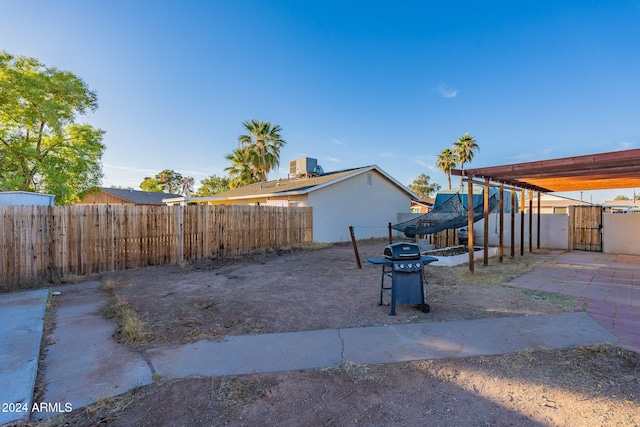 view of yard with a patio and central AC unit