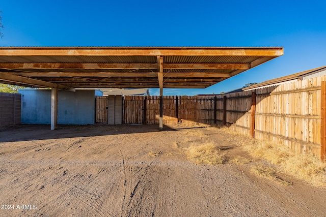 view of parking / parking lot with a carport