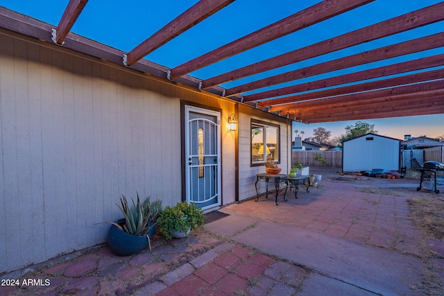 patio terrace at dusk with a storage unit