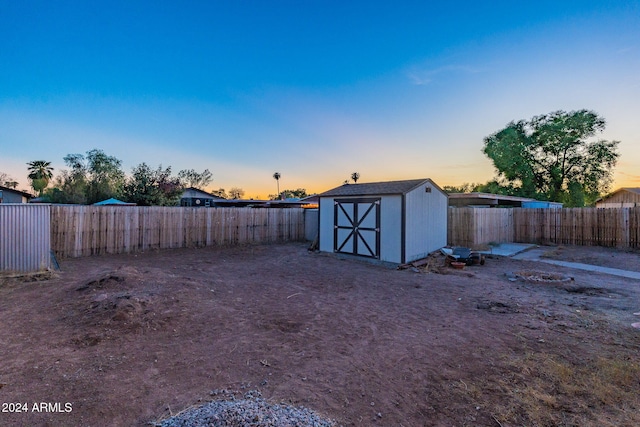 yard at dusk with a shed