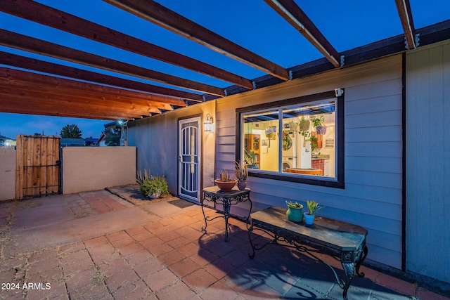 view of patio terrace at dusk