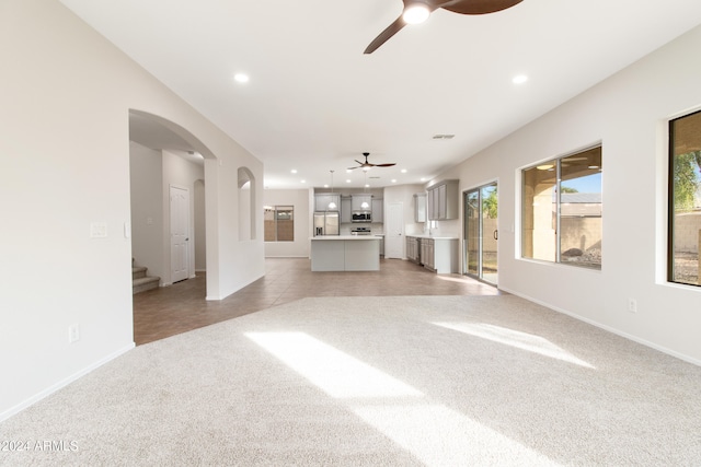 unfurnished living room with light carpet