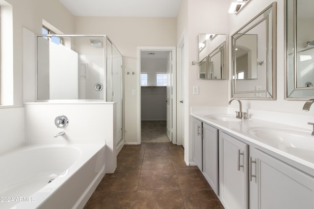 bathroom with vanity, plus walk in shower, and tile patterned floors