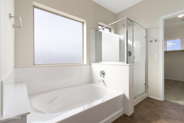 bathroom featuring tile patterned floors and plus walk in shower