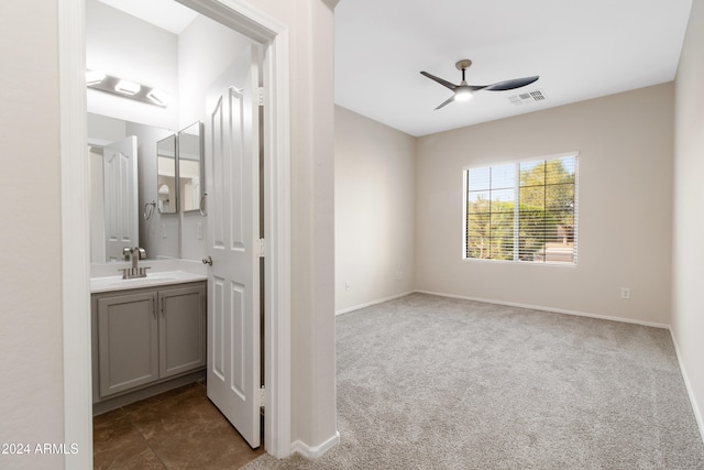 bathroom with vanity and ceiling fan