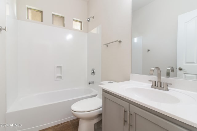 full bathroom with vanity, bathtub / shower combination, tile patterned floors, and toilet