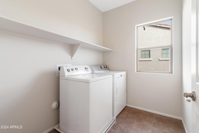 washroom featuring washer and clothes dryer