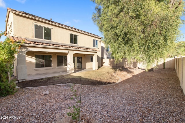 back of house with a patio area