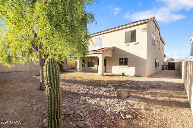 rear view of property featuring a patio area