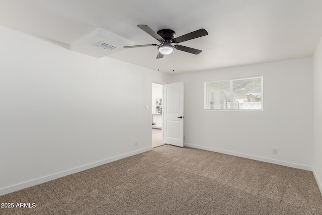 carpeted empty room with ceiling fan, visible vents, and baseboards