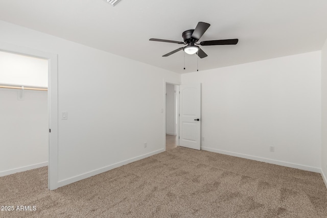 unfurnished bedroom featuring carpet, a closet, and baseboards