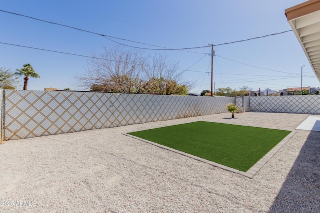 view of yard with a fenced backyard