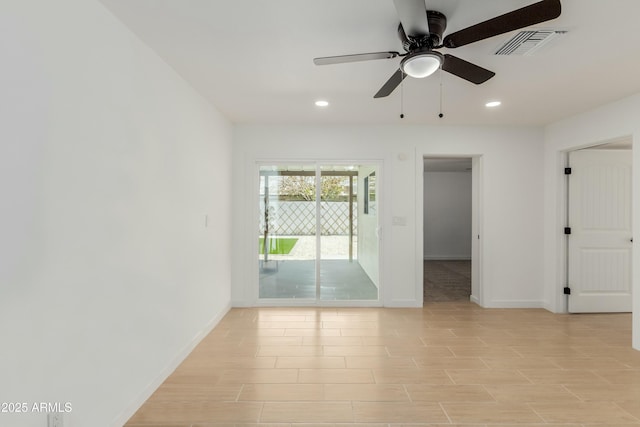 empty room featuring recessed lighting, visible vents, and baseboards