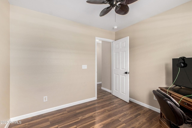 home office with baseboards, a ceiling fan, and dark wood-style flooring