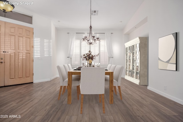 14056 E Desert Cove Ave, Scottsdale, AZ 85259 - dining room featuring a chandelier, wood finished floors, and baseboards