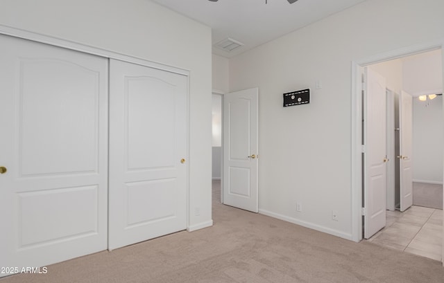 14056 E Desert Cove Ave, Scottsdale, AZ 85259 - unfurnished bedroom with light carpet, a closet, and baseboards