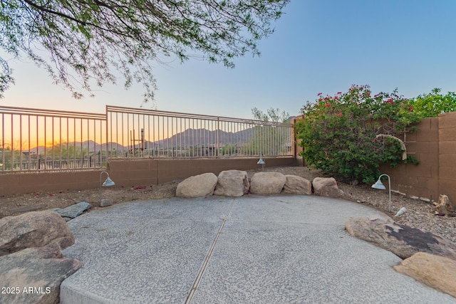 14056 E Desert Cove Ave, Scottsdale, AZ 85259 - patio terrace at dusk with a fenced backyard and a patio area