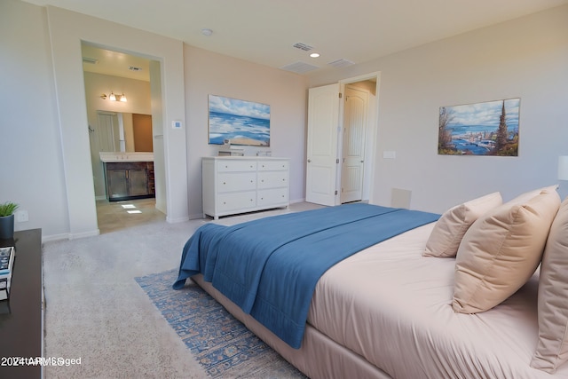 bedroom featuring ensuite bathroom