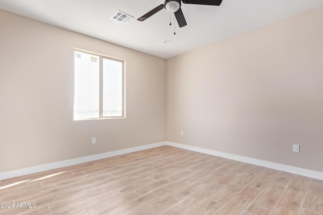 unfurnished room with ceiling fan and light hardwood / wood-style floors