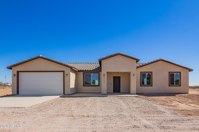 view of front of property featuring a garage