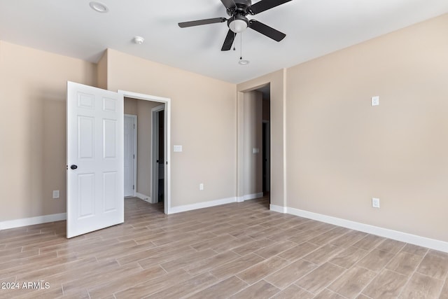 unfurnished bedroom featuring ceiling fan