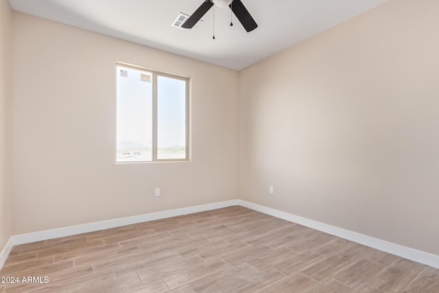 spare room with ceiling fan and light hardwood / wood-style floors