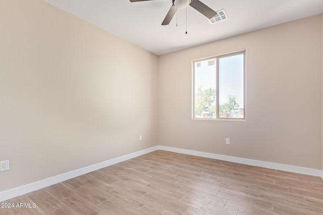 unfurnished room featuring light wood-type flooring and ceiling fan