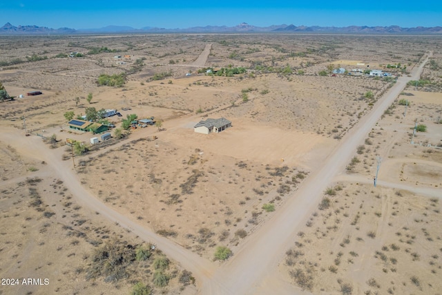 birds eye view of property featuring a mountain view