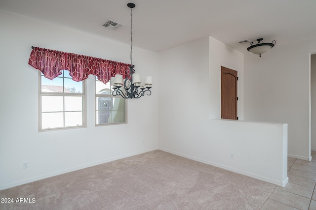 unfurnished dining area with light carpet and a notable chandelier