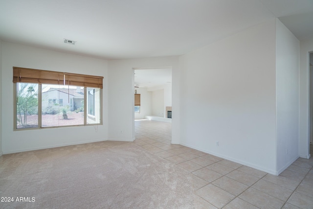 empty room featuring light carpet