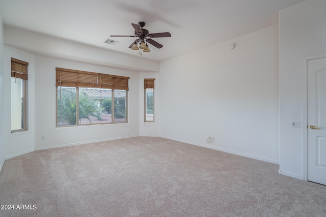 unfurnished room featuring ceiling fan and light colored carpet