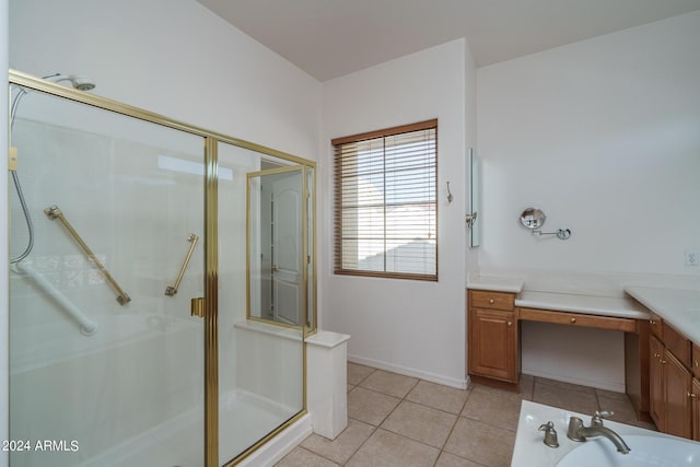 bathroom with tile patterned flooring, vanity, and a shower with shower door