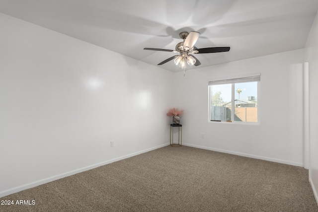 empty room featuring ceiling fan and carpet flooring