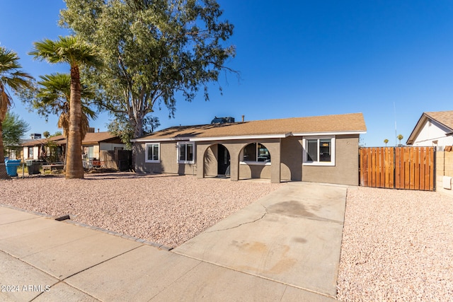 ranch-style home featuring a patio