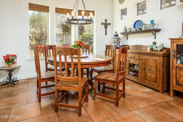 dining area with an inviting chandelier