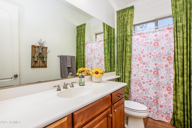 bathroom with vanity and toilet