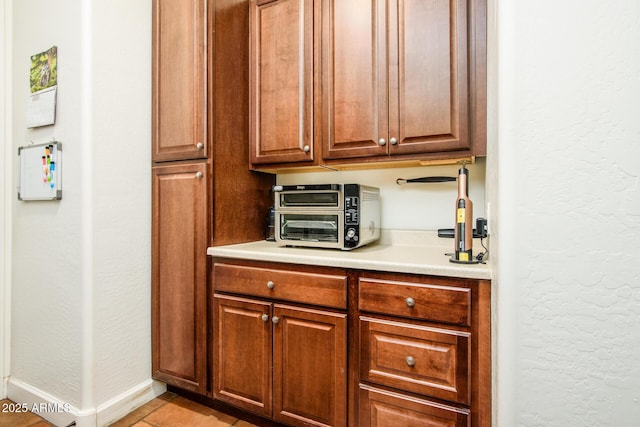 kitchen with light tile patterned floors