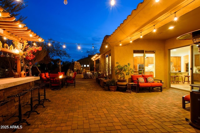 view of patio / terrace featuring an outdoor living space and an outdoor bar