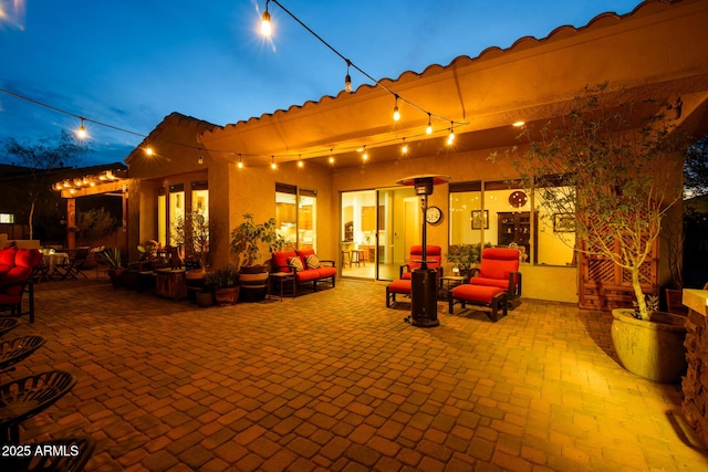 view of patio terrace at dusk