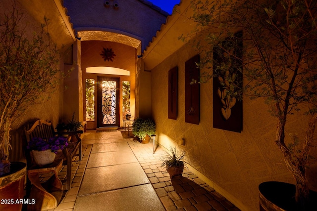 doorway to property with a patio area