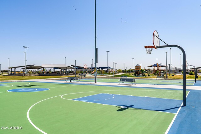 view of sport court with a playground