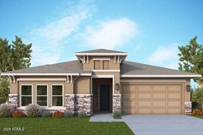 prairie-style home featuring a garage and a front yard