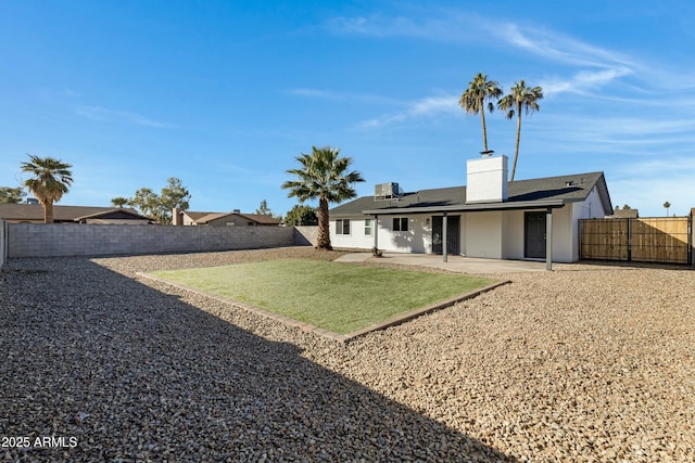 view of yard with cooling unit and a patio