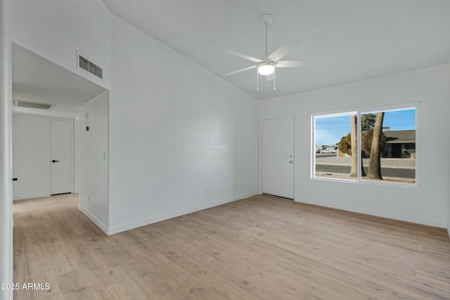 unfurnished room featuring light hardwood / wood-style flooring, ceiling fan, and vaulted ceiling