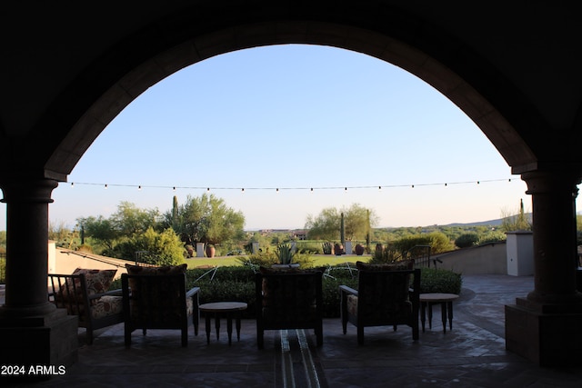 view of patio terrace at dusk